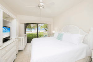 The bedroom of a Grand Cayman condo rental that's close to popular activities.