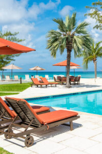 The pool area of a Grand Cayman condo resort to relax at after checking out local attractions.